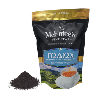 McEntee's Fine Teas Manx breakfast blend loose leaf tea package with tea leaves on a white background