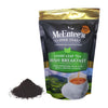 McEntee's Fine Teas Irish Breakfast loose leaf tea package with tea leaves on a white background