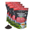 Multiple packages of McEntee's Fine Teas Gold Blend loose leaf tea on a white background.
